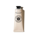 a tube of hand balm with a black cap and a white label.