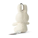 A white stuffed bunny toy with a tag attached to it.