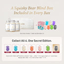 The image is a promotional graphic for a product called "A Squishy Bear Blind Box" that includes a "Teddi Lab Blind Box" and a "One Secret Edition" with a collection of six unique bears.