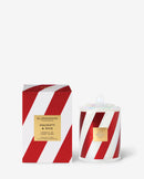 a red and white striped box and a white and red striped candle container, both of which are labeled as "Naughty & Nice Handmade" and "Candy Cane".