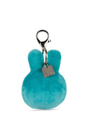 A teal-colored plush keychain with a metal clasp and a small tag attached to it.