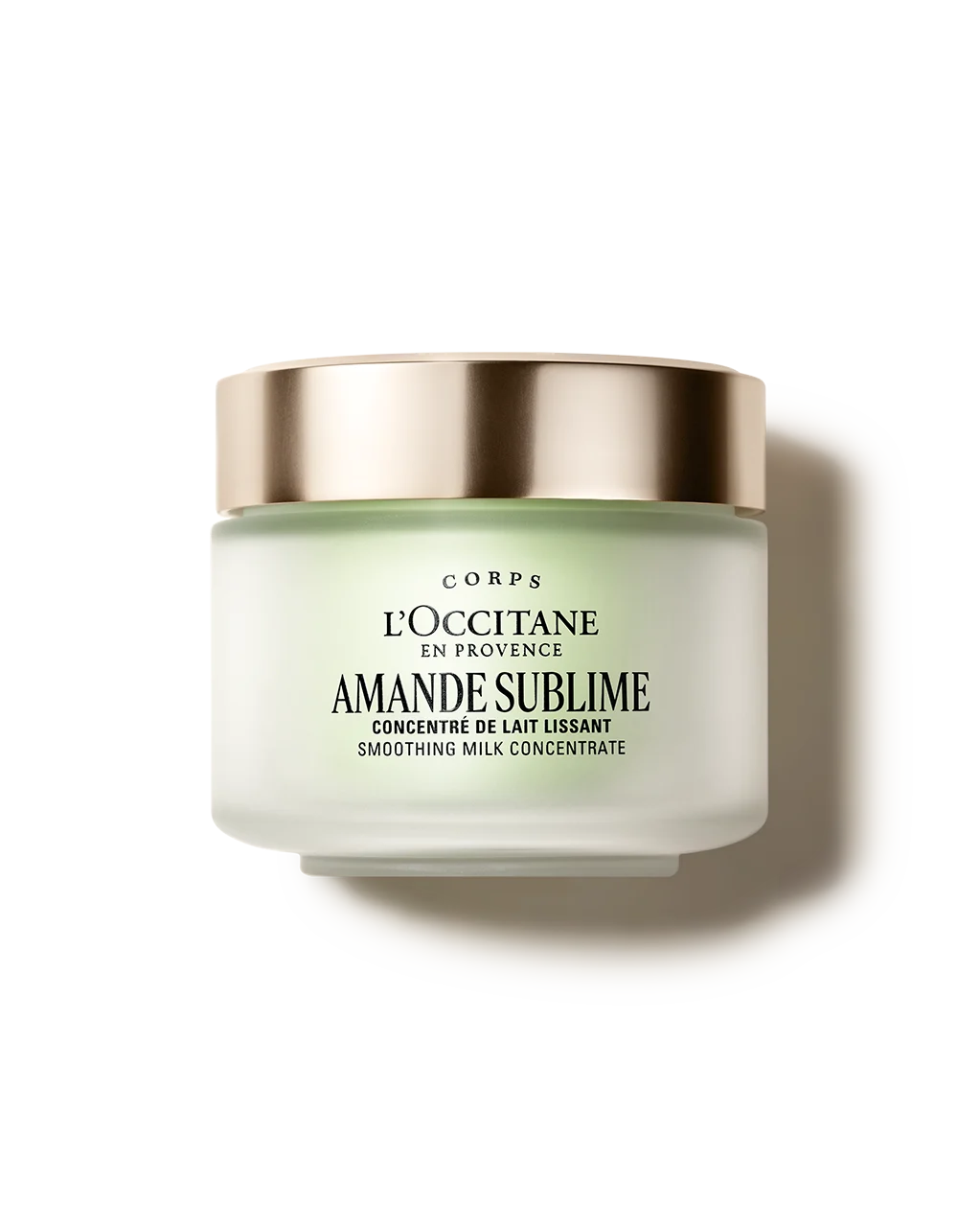 a jar of lotion with a gold rim, labeled as a "L'OCCITANE EN PROVENCE AMANDE SUBLIME" product.
