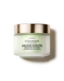 a jar of lotion with a gold rim, labeled as a "L'OCCITANE EN PROVENCE AMANDE SUBLIME" product.